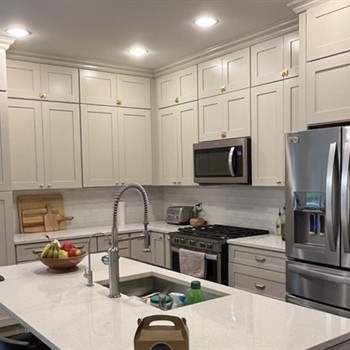Why Is Spray Painting Better Than Brush Painting for Cabinets?